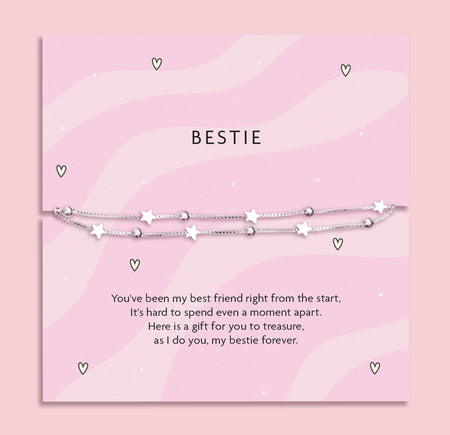 Silver-plated star bracelet on a pink wavy poem card with a meaningful sentiment for a friend. Making a perfect gift for a best friend.