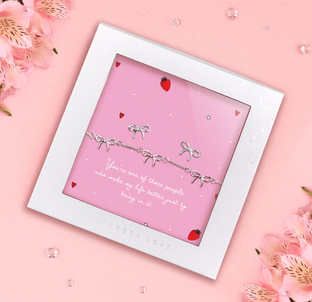 Silver-plated bow bracelet and earrings set, presented in a gift box with a heartfelt sentiment card that celebrates friendship and appreciation.