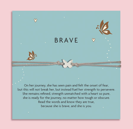 Grey cord bracelet with a silver butterfly charm, displayed on a teal card with butterflies and the word 'Brave'. The card features an inspirational message about strength, resilience, and courage. An empowering gift from Letterbox Love.