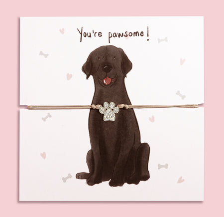 Paw print bracelet gift on illustrated card featuring a cute Chocolate Lab and 'You're pawsome!' message – perfect jewellery gift for dog mums and Labrador lovers.