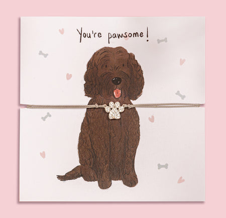 Paw print bracelet gift on illustrated card featuring a cute cockapoo and 'You're pawsome!' message – perfect jewellery gift for dog mums and cockapoo lovers.