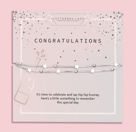 Letterbox Love 'Congratulations' bracelet gift – silver star and bead charm bracelet on a champagne-themed card with celebratory confetti design and message. A perfect letterbox jewellery gift for graduation, new job, engagement or any special milestone worth celebrating. Thoughtful and affordable gift for her.