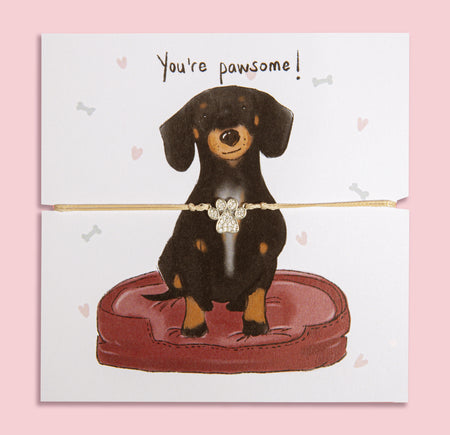 Paw print bracelet gift on illustrated card featuring a cute Dachshund and 'You're pawsome!' message – perfect jewellery gift for dog mums and Dachshund lovers.