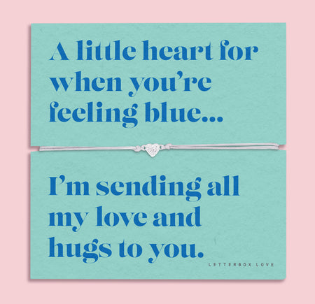 A teal-colored bracelet card titled