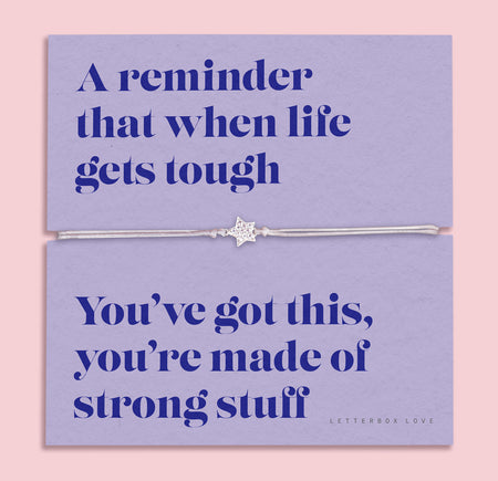A lavender-colored bracelet card titled