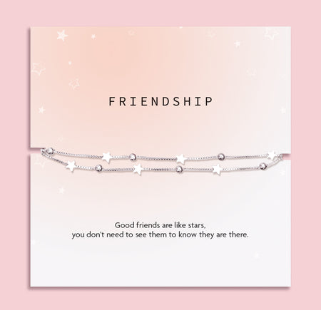 Double-chain silver star and bead bracelet mounted on a blush pink and white sentiment card that reads: