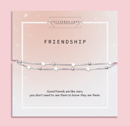 Double-chain silver star and bead bracelet mounted on a blush pink and white sentiment card that reads: