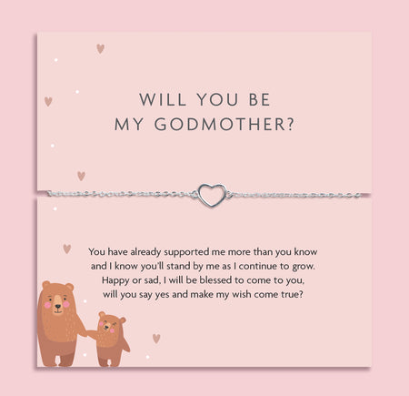 Silver heart charm bracelet displayed on a pink proposal card reading