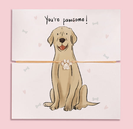 Paw print bracelet gift on illustrated card featuring a cute Golden Labrador and 'You're pawsome!' message – perfect jewellery gift for dog mums and Golden Lab lovers.
