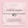 Silver beaded bracelet with heart and flower charms, presented in a white gift box alongside a card titled