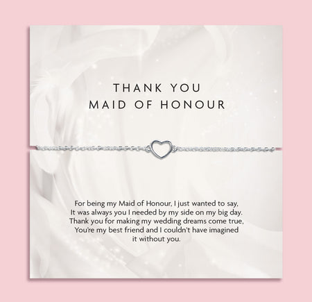 A 'THANK YOU MAID OF HONOUR' appreciation card from Letterbox Love with a pink background. The card displays a heartfelt message of gratitude and features a delicate silver bracelet with a heart-shaped charm. A cute bracelet for a maid of honour.