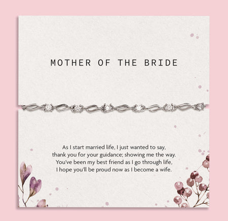 Bracelet on a card with 'Mother of the Bride' text and floral design on a pink background. An elegant silver bracelet for the Mother of the Bride. Wedding gifts.