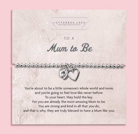 Silver beaded bracelet with heart and baby footprint charms, displayed on a sentimental card reading