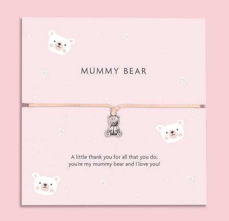 A soft pink bracelet card with a cute teddy bear charm, featuring the text