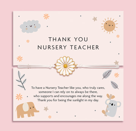White adjustable cord bracelet with a gold and white enamel daisy charm, displayed on a soft pink thank you card that reads 'Thank You Nursery Teacher'. Surrounded by cute illustrations of a sun, cloud, elephant, and koala, with a heartfelt poem. A thoughtful end-of-term gift by Letterbox Love.