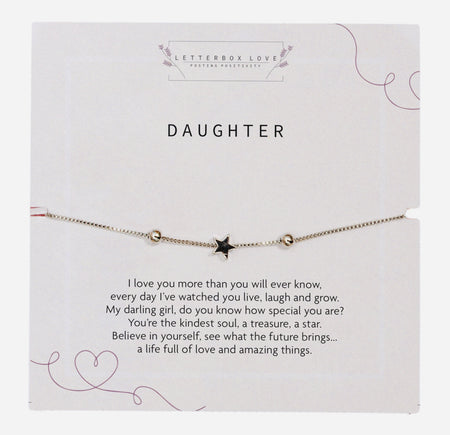 Elegant bracelet with a single silver star charm centred on a delicate silver chain, presented on a white card with the word 'DAUGHTER' in bold typeface. Below the bracelet, a loving poem expresses admiration and encouragement, enhancing the sentimental value of the jewellery. 