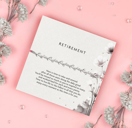 Silver leaf bracelet, a thoughtful gift for retirement. Presented on a 'Retirement' card featuring a heartfelt message celebrating years of hard work and dedication. Perfect for someone retiring, this elegant bracelet symbolizes relaxation, new beginnings, and enjoying life's next chapter.