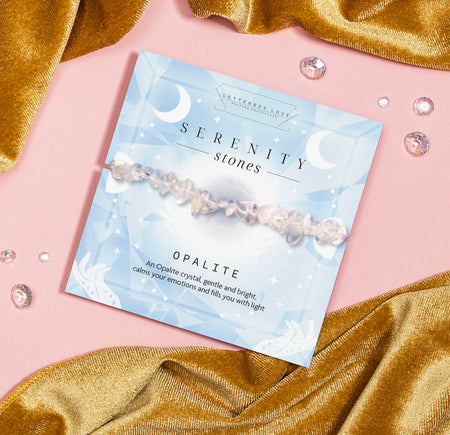 Serenity Stones Opalite crystal bracelet with smooth opalite beads on a celestial-themed card, offering good energy, calmness, and emotional healing. Perfect gift for mindfulness, spiritual wellness, and crystal healing enthusiasts