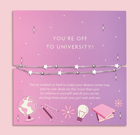 A delicate double-layer silver bracelet featuring star charms and beads, displayed on a lilac backing card with the message