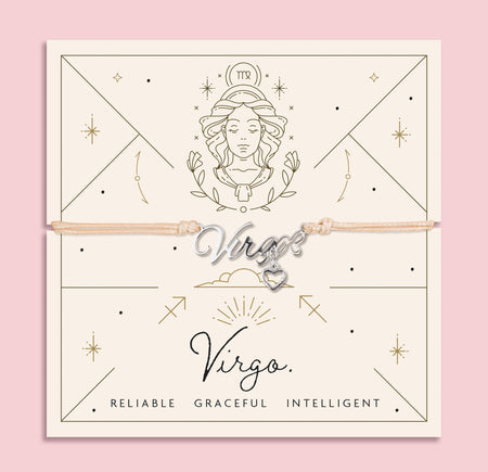 Zodiac Virgo bracelet with silver calligraphy-style charm and dangling heart, on beige cord with celestial cream and gold Virgo card featuring traits: Reliable, Graceful, Intelligent.