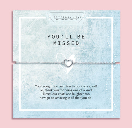 Silver heart bracelet on a blue card with text message on a pink background. A cute bracelet gift for a leaving present under £20