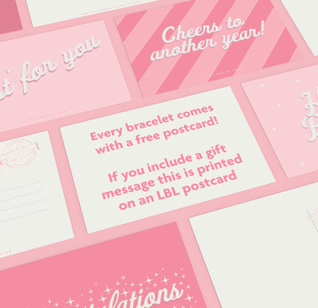 a bunch of pink and white greeting cards