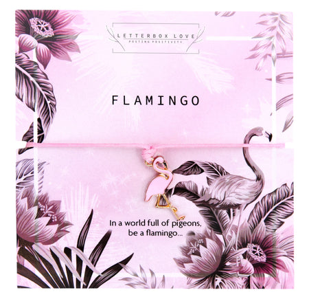 A pink bracelet featuring a small flamingo charm on a matching pink cord. The background card reads