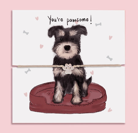 Cute paw print bracelet gift displayed on illustrated card with Schnauzer dog and 'You're pawsome!' message – perfect for dog lovers and animal-themed jewellery gifts.
