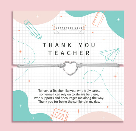 Appreciative 'Thank You Teacher' card on a soft pink background, adorned with geometric and school-related illustrations. The card features heartfelt gratitude text and is accompanied by a delicate bracelet with a heart charm.