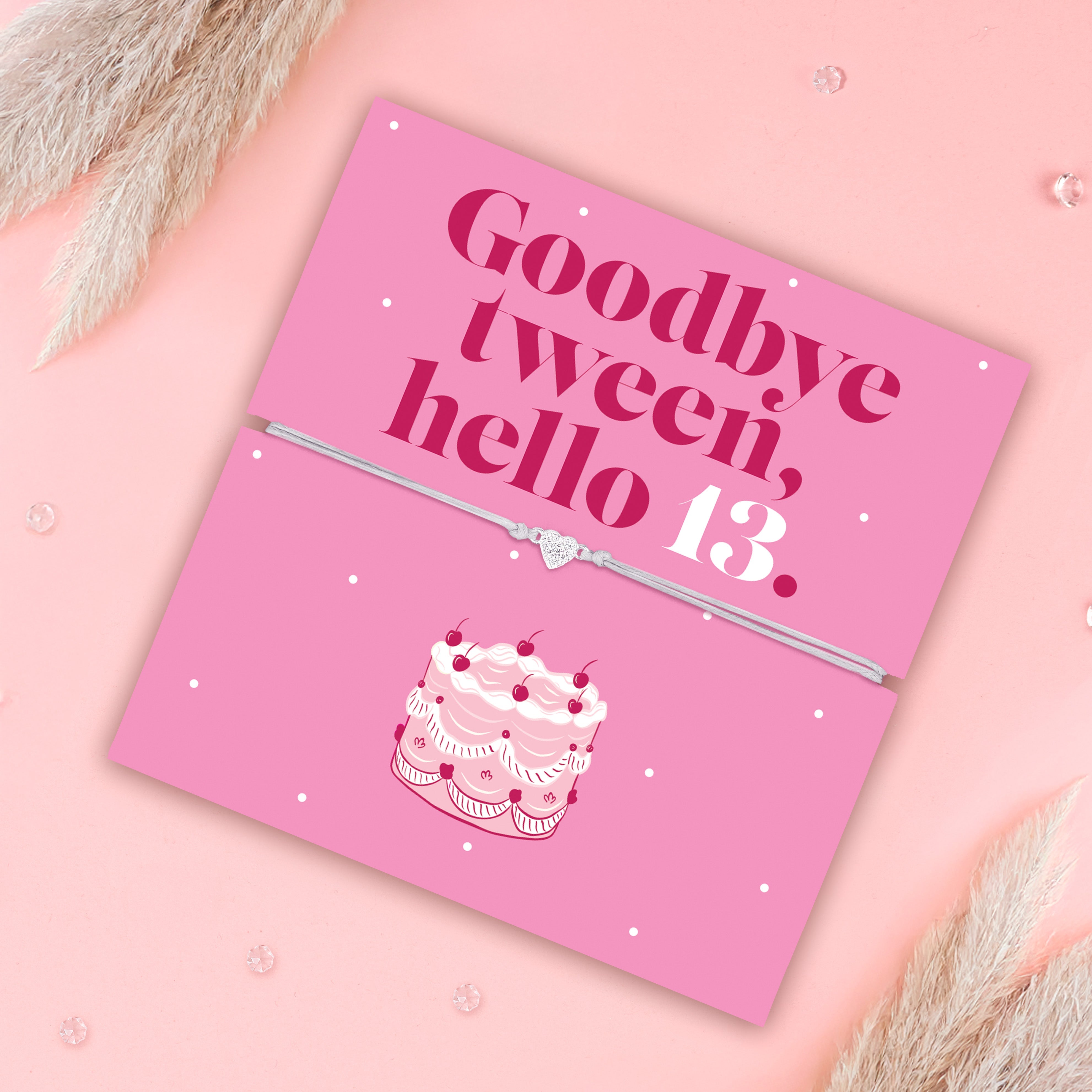 A pink background with a bright pink 13th birthday gift and elegant affordable bracelet. 'Goodbye tween, hello 13.
