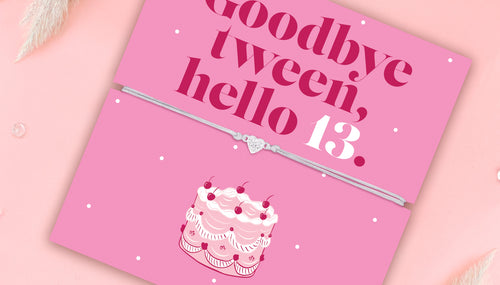 A pink background with a bright pink 13th birthday gift and elegant affordable bracelet. 'Goodbye tween, hello 13."