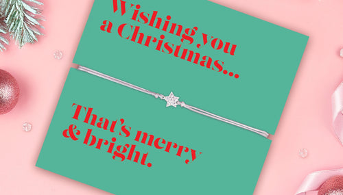 a pale pink background and green poem card with star bracelet, a beautiful stocking filler for a woman