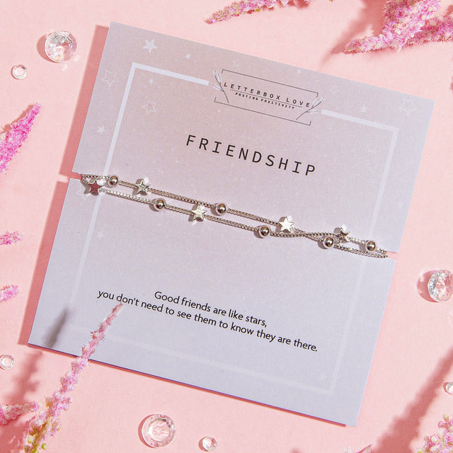 Letterbox Love silver-plated friendship bracelet with star and bead detailing, set on a ‘Friendship’ card with a sentimental quote. Perfect meaningful friendship gift and affordable stocking filler for Christmas under £20.