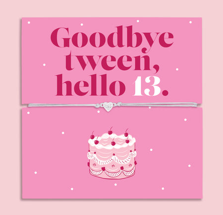 13th birthday bracelet with sparkling zircon heart charm on an adjustable cord, displayed on a pink “Goodbye Tween, Hello 13” message card with birthday cake illustration.