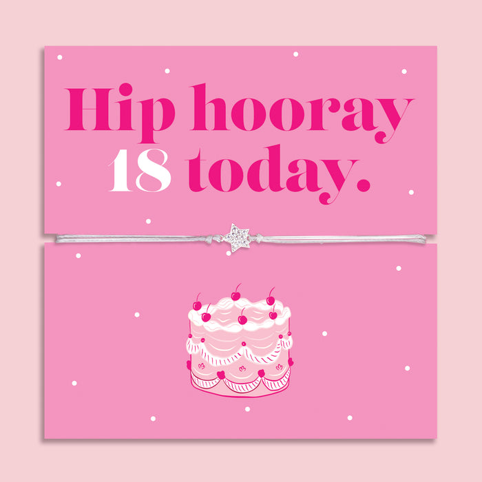 18th birthday bracelet with sparkling zircon heart charm on an adjustable cord, displayed on a pink “Hip Hooray, 18 Today” message card with illustrated birthday cake.
