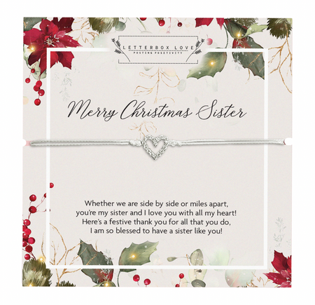 A delicate bracelet with a silver heart charm displayed on a festive card titled 