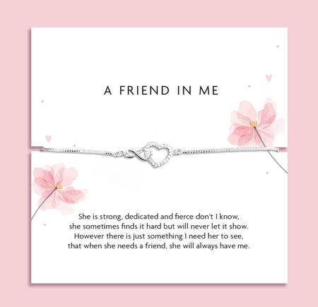 Silver infinity heart bracelet displayed on a friendship poem card with pink floral illustrations, presented as an adjustable bracelet that comes in a soft pink pouch.
