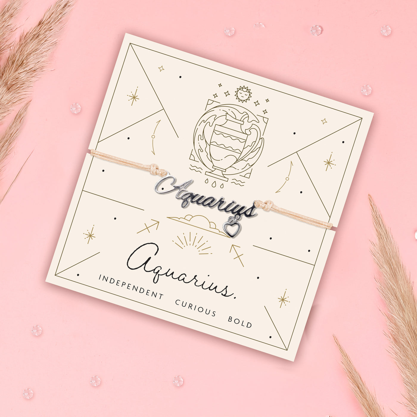 Aquarius-themed bracelet on a matching card with decorative elements on a pink background. Star sign jewellery for women.