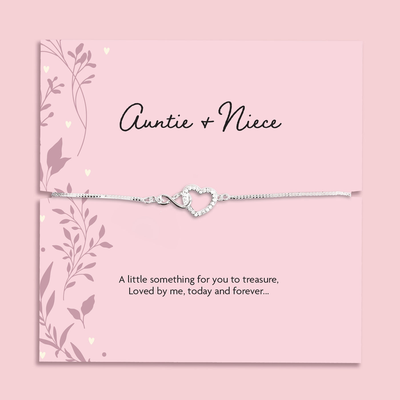 Silver plated Auntie and Niece adjustable bracelet with sparkling cubic zirconia interlocking heart charm, presented on a pink sentiment card and supplied in a soft pink jewellery pouch. Meaningful gift for auntie or niece.