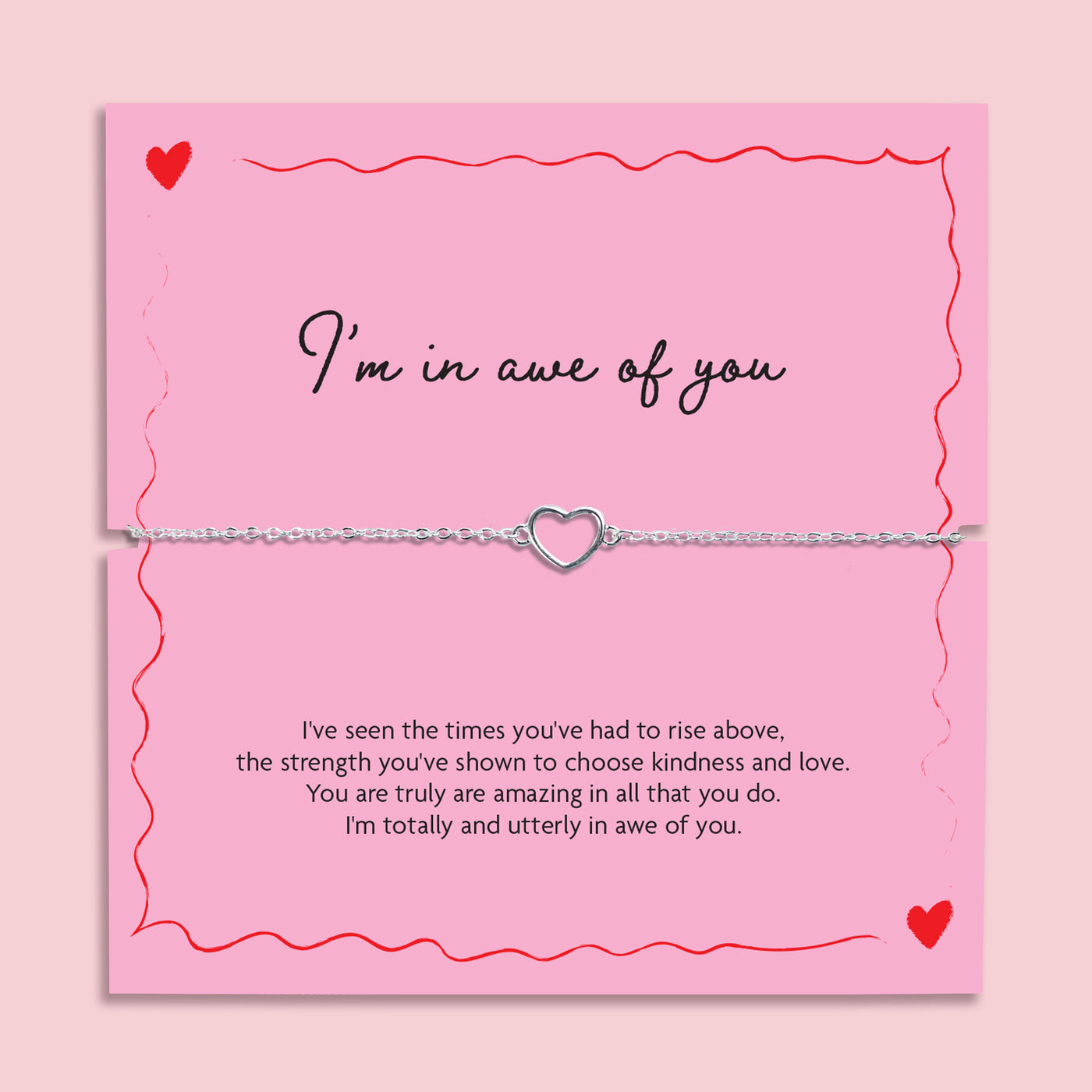 Silver chain bracelet with open heart charm displayed on a pink “I’m In Awe Of You” poem card with red heart illustrations, meaningful gift for her.