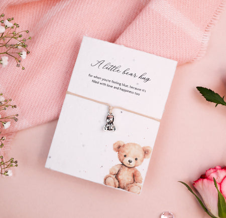 Letterbox Love A Little Bear Hug bracelet with a silver bear charm, set on a card with a cute bear illustration and a sentimental message. Perfect thoughtful gift for friends or loved ones, eco-friendly and seed paper design.