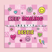Pink chequered poem card with the bold text saying "Keep Smiling Bestie", with a beaded bracelet spelling the word "Bestie". An ideal gift for a best friend.