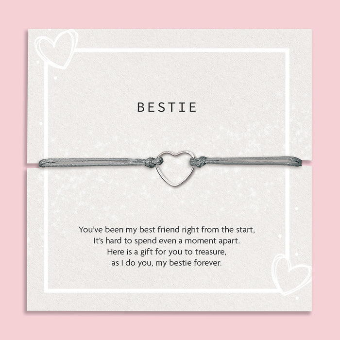 Bracelet with heart charm on a 'Letterbox Love' card with text on a pink background.  A meaningful sentiment for a friend. A gift under £10 for a best friend