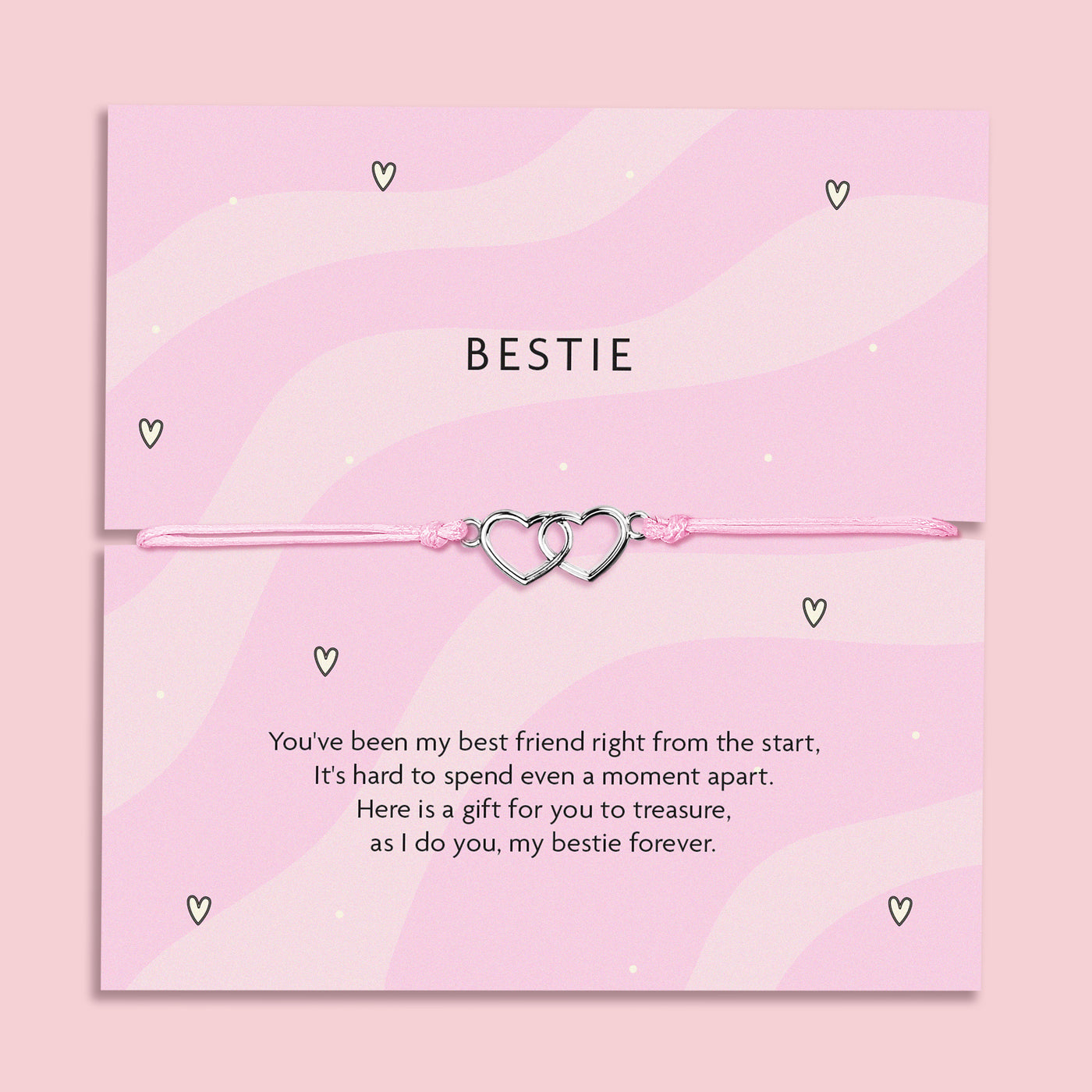 A pink bracelet card with two heart charms, featuring the text 