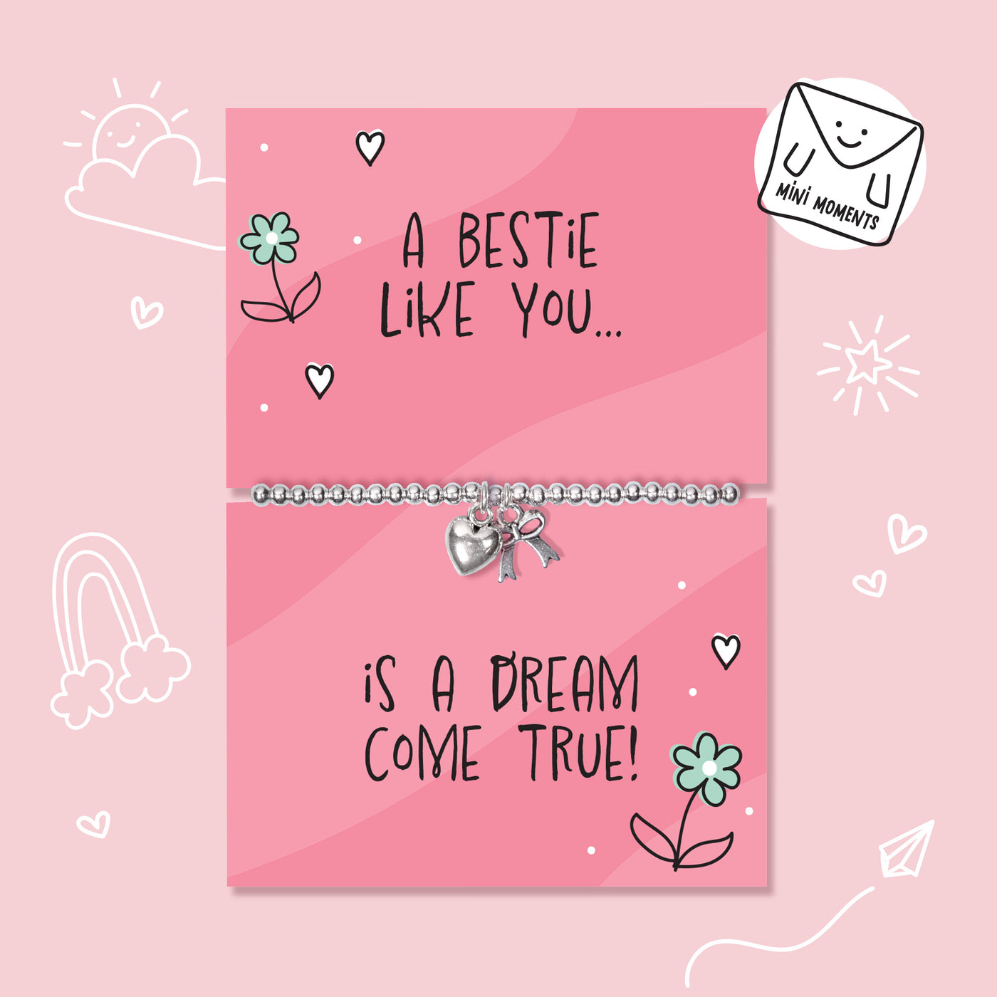 A silver beaded bracelet with a heart and key charm is displayed on a pink gift card that reads 'A BESTIE LIKE YOU.