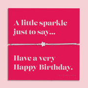 A pink poem card with "Happy Birthday" for a friend and a grey string bracelet with a cute sparkly star charm. A friendship happy birthday gift