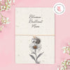 Adjustable string bracelet with silver heart and sunflower charms presented on a plantable seeded greeting card reading “Bloomin’ Brilliant Mum” with daisy illustration.