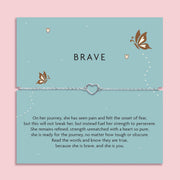 Silver plated hollow heart Brave bracelet displayed on a blue sentiment card with butterfly illustrations and an inspirational poem about strength and courage.
