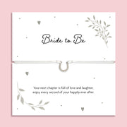 Bride to Be sentiment card featuring an adjustable white cord bracelet with a sparkling horseshoe charm, meaningful bridal shower gift and wedding keepsake for the future bride.