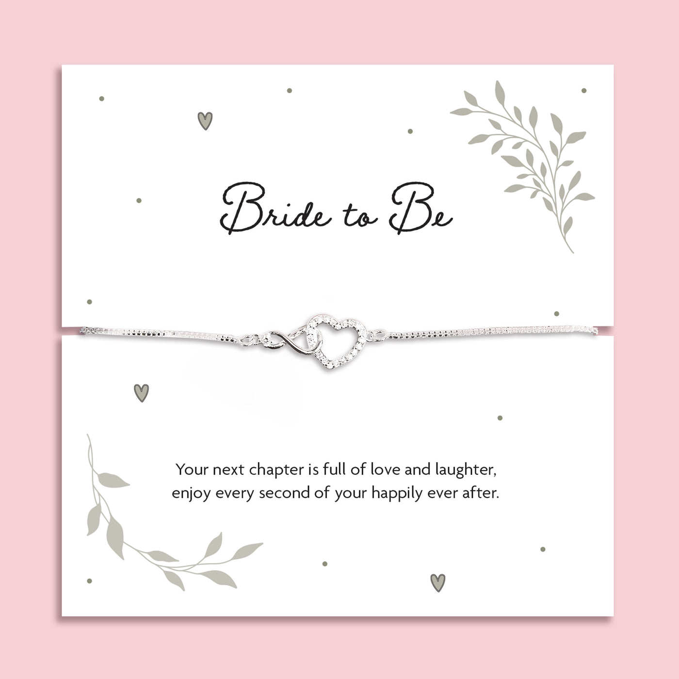 Silver zirconia heart and infinity charm bracelet displayed on a white card with the words 
